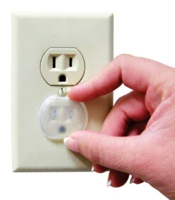 DREAMBABY CLEAR PLASTIC OUTLET PROTECTOR 12 PK -Little Nest Co. Store 5988688 A.eps High 63648.1622320226